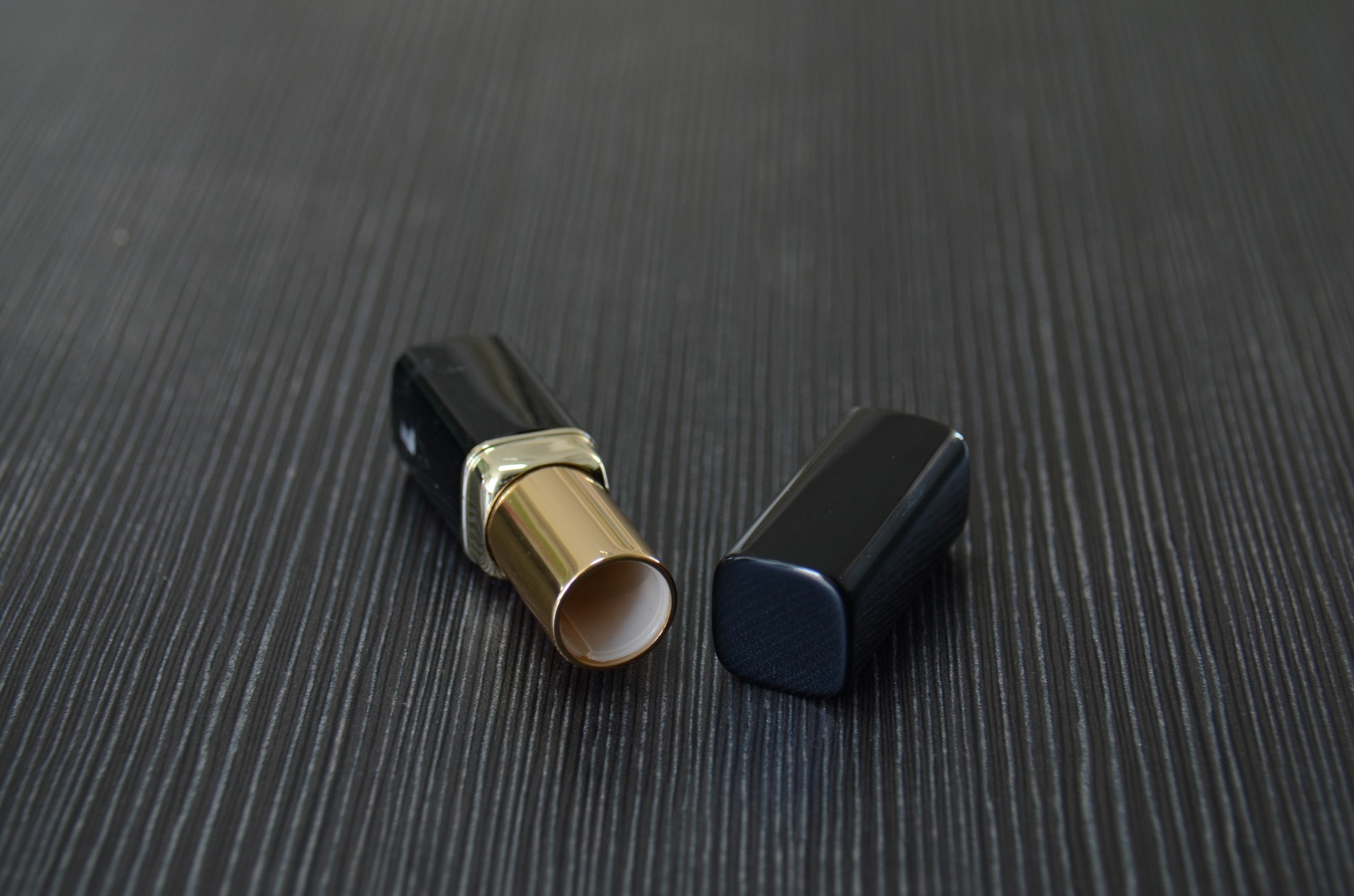 black empty metal lipstick tube